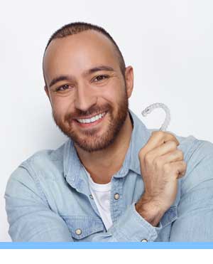 Cost of Invisalign interior photo man with bracket San Marcos Orthodontics San Marcos CA